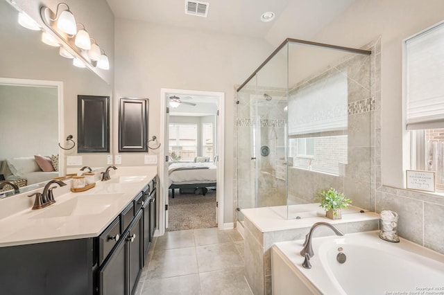 ensuite bathroom featuring a sink, a garden tub, connected bathroom, and visible vents