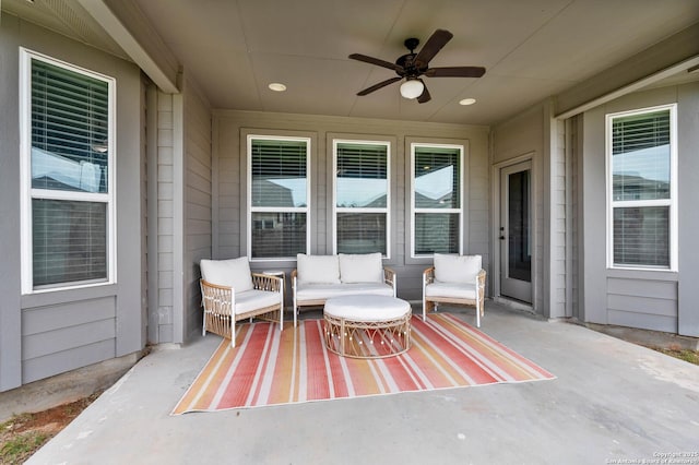 view of patio / terrace featuring ceiling fan and an outdoor living space