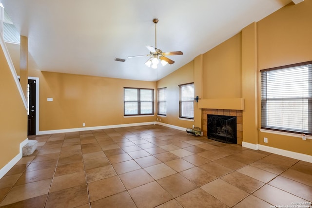unfurnished living room featuring high vaulted ceiling, a tiled fireplace, a ceiling fan, light tile patterned floors, and visible vents