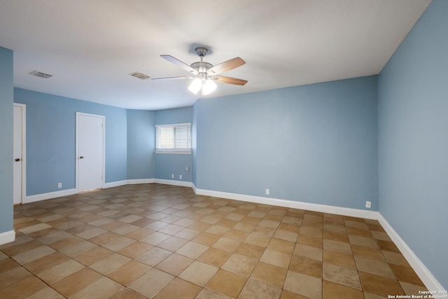 empty room featuring visible vents, baseboards, ceiling fan, and light tile patterned floors
