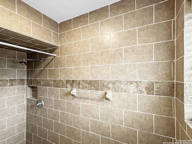 bathroom with tiled shower