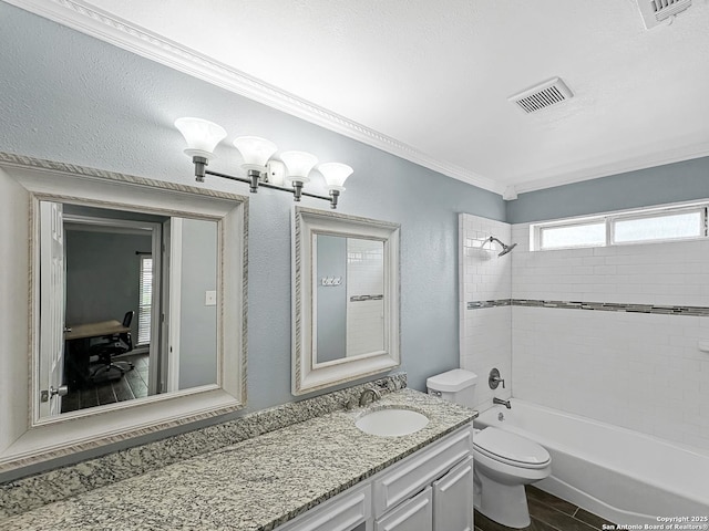 full bathroom featuring visible vents, ornamental molding, vanity, toilet, and bathtub / shower combination