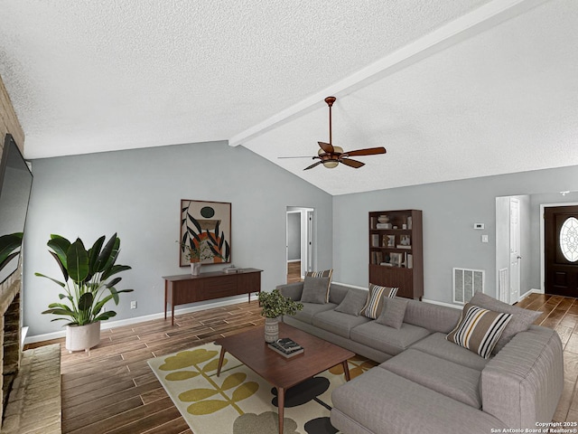 living area with ceiling fan, visible vents, baseboards, and wood tiled floor