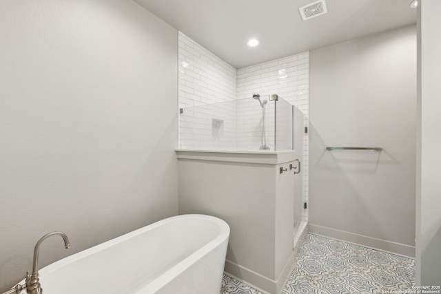 full bathroom with visible vents, a walk in shower, baseboards, a soaking tub, and recessed lighting