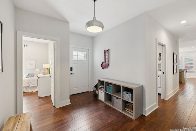 entryway with a healthy amount of sunlight, baseboards, recessed lighting, and dark wood finished floors