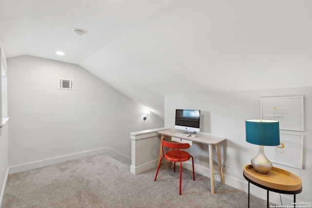 office space with baseboards, visible vents, carpet flooring, and lofted ceiling