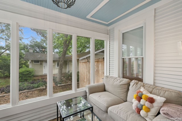 sunroom featuring outdoor lounge area and a wealth of natural light