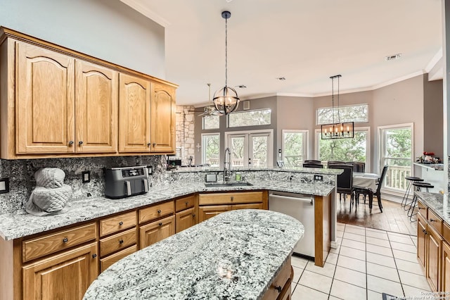 27030 Vaughns Vw, San Antonio, TX 78260 - kitchen with visible vents, stainless steel dishwasher, a sink, a peninsula, and an inviting chandelier