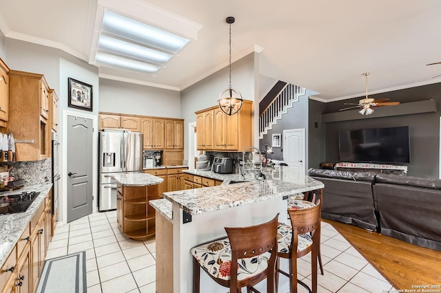 27030 Vaughns Vw, San Antonio, TX 78260 - kitchen with decorative backsplash, a peninsula, light tile patterned flooring, a sink, and stainless steel appliances