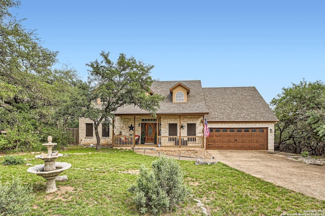 27030 Vaughns Vw, San Antonio, TX 78260 - view of front facade with a garage, covered porch, a front yard, stone siding, and roof with shingles