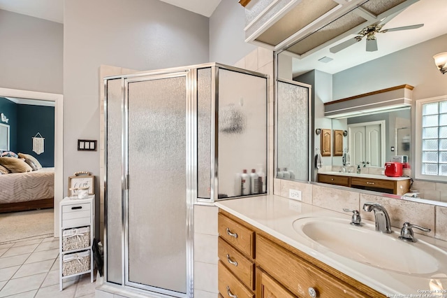 27030 Vaughns Vw, San Antonio, TX 78260 - ensuite bathroom featuring vanity, tile patterned floors, ceiling fan, and a stall shower
