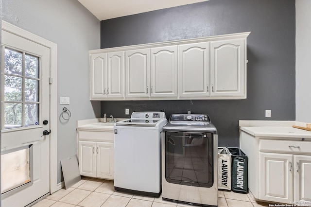 27030 Vaughns Vw, San Antonio, TX 78260 - washroom with a sink, washer and clothes dryer, cabinet space, and light tile patterned flooring
