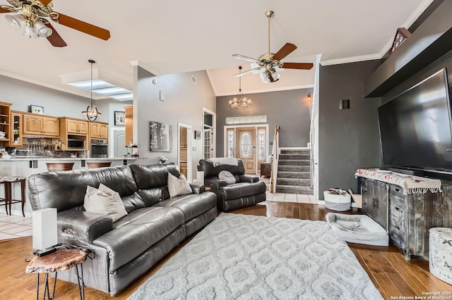 27030 Vaughns Vw, San Antonio, TX 78260 - living area with crown molding, high vaulted ceiling, wood finished floors, and ceiling fan with notable chandelier