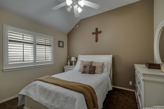 bedroom featuring baseboards, a ceiling fan, dark carpet, and lofted ceiling