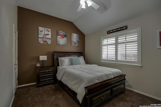 bedroom with dark colored carpet, baseboards, ceiling fan, and vaulted ceiling