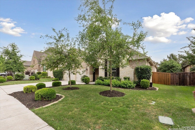 view of front of property featuring fence, a front lawn, and stone siding