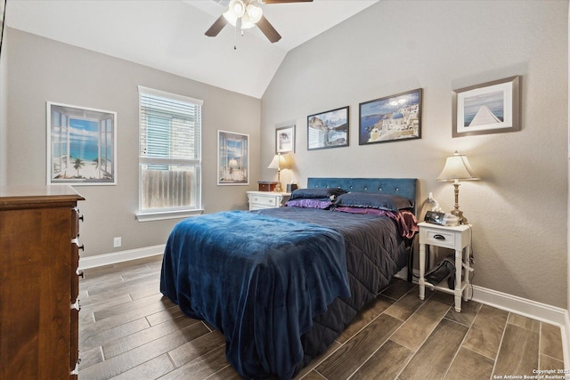 bedroom featuring baseboards, a ceiling fan, wood finished floors, and vaulted ceiling