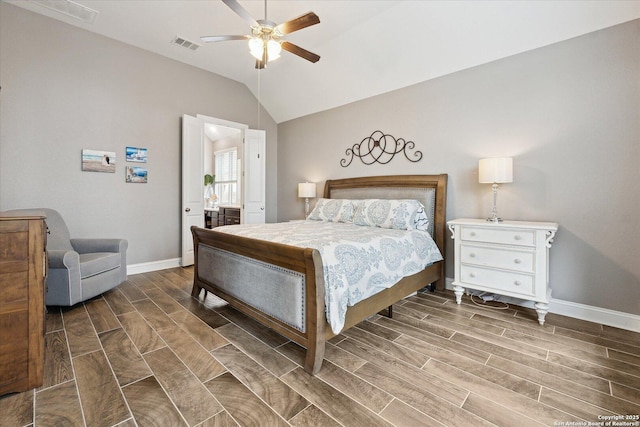 bedroom with baseboards, lofted ceiling, wood finish floors, and visible vents
