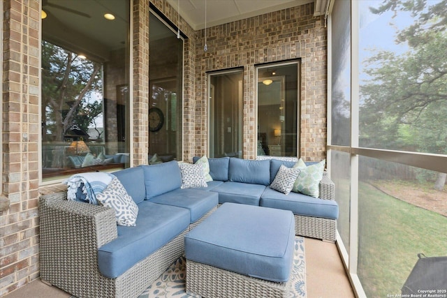 sunroom with an outdoor living space