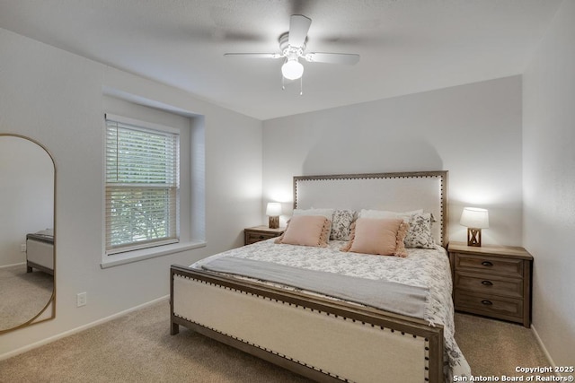 bedroom with baseboards, ceiling fan, and carpet