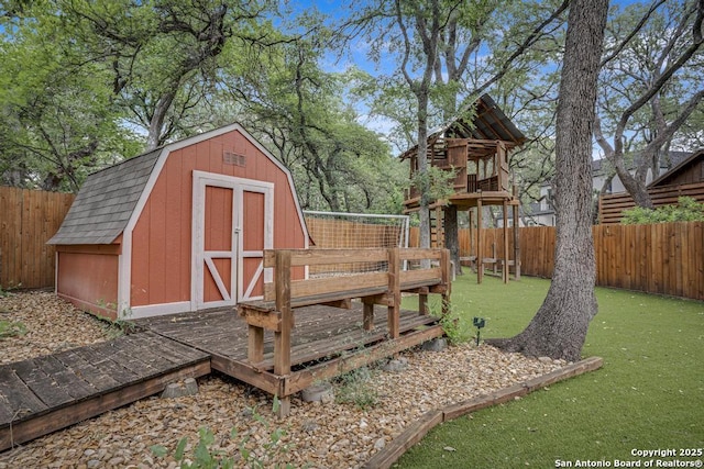 view of shed with a fenced backyard