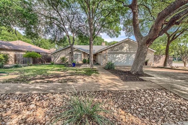 13402 Vista Del Mar, San Antonio, TX 78216 - view of front of home with fence, a chimney, brick siding, concrete driveway, and an attached garage