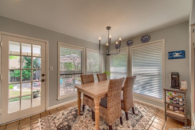 13402 Vista Del Mar, San Antonio, TX 78216 - dining area featuring an inviting chandelier, light tile patterned floors, and baseboards