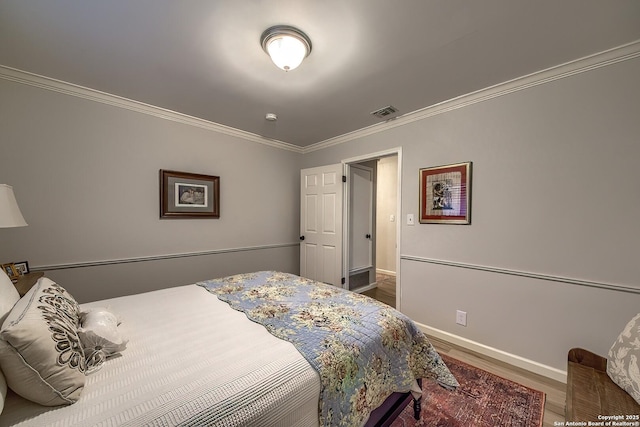 13402 Vista Del Mar, San Antonio, TX 78216 - bedroom featuring crown molding, baseboards, wood finished floors, and visible vents