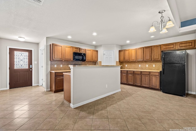 kitchen with recessed lighting, a notable chandelier, black appliances, and tasteful backsplash
