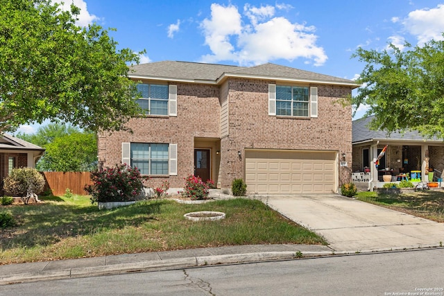 traditional home with a garage, brick siding, fence, a front lawn, and concrete driveway