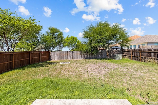 view of yard with a fenced backyard