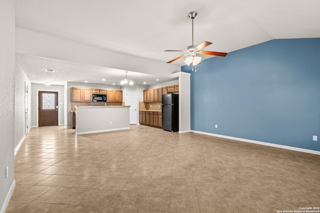 unfurnished living room with ceiling fan with notable chandelier, recessed lighting, baseboards, light tile patterned floors, and vaulted ceiling
