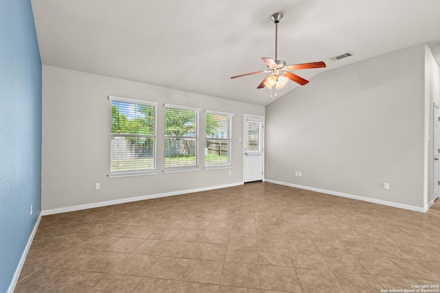 spare room featuring a ceiling fan, visible vents, plenty of natural light, and vaulted ceiling