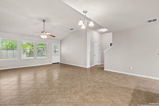 unfurnished living room featuring visible vents, tile patterned floors, ceiling fan with notable chandelier, and lofted ceiling