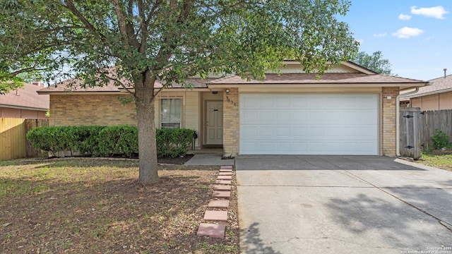 3634 Ridge Cluster, San Antonio, TX 78247 - view of front of property featuring fence, an attached garage, driveway, and brick siding