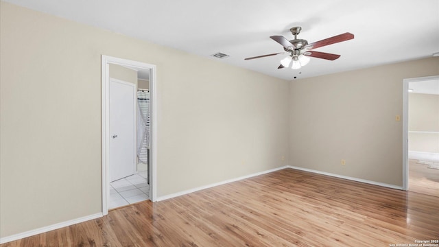 3634 Ridge Cluster, San Antonio, TX 78247 - unfurnished bedroom featuring ceiling fan, visible vents, baseboards, ensuite bathroom, and light wood-style flooring