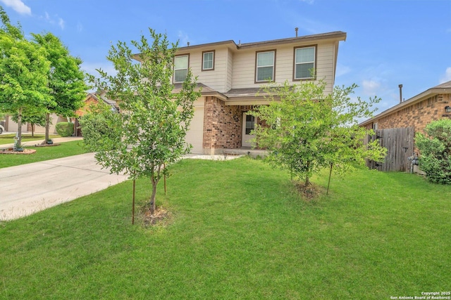 view of front of house featuring fence, concrete driveway, a front yard, and brick siding