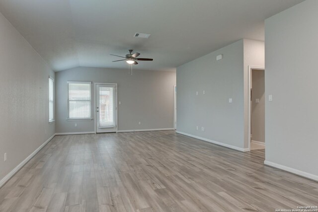 unfurnished living room featuring ceiling fan, baseboards, and light wood-type flooring
