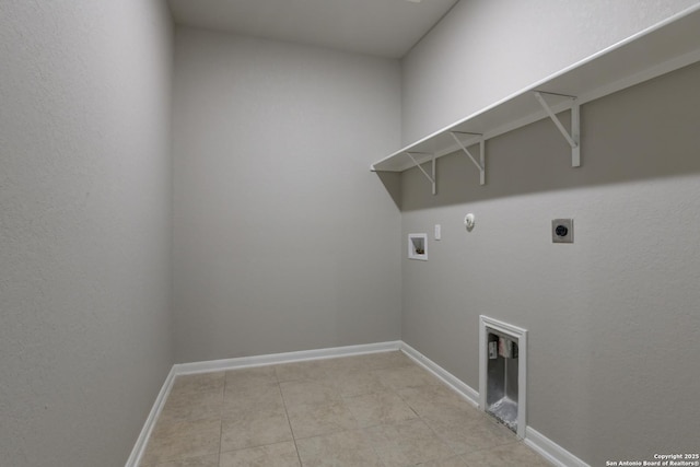 washroom featuring laundry area, washer hookup, baseboards, hookup for a gas dryer, and hookup for an electric dryer