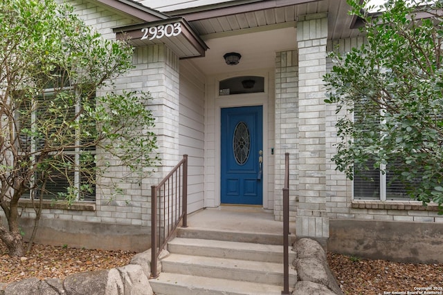 29303 Sumpter Dr, Boerne, TX 78015 - property entrance featuring brick siding