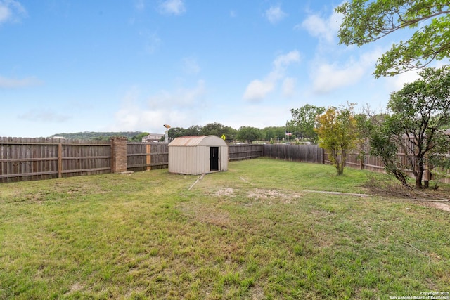 29303 Sumpter Dr, Boerne, TX 78015 - view of yard featuring a storage shed, an outdoor structure, and a fenced backyard