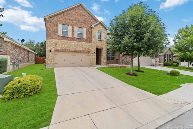 traditional home with fence, a front lawn, concrete driveway, an attached garage, and stone siding