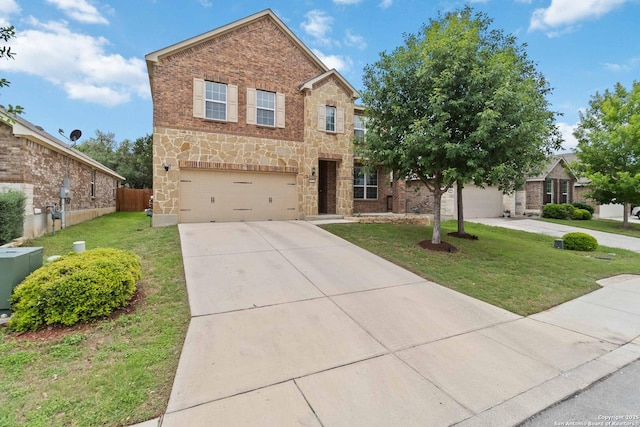 traditional home with fence, a front yard, stone siding, concrete driveway, and an attached garage