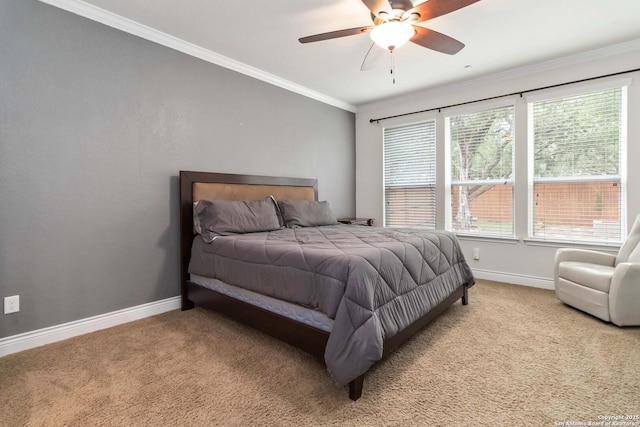 bedroom featuring baseboards, carpet flooring, a ceiling fan, and ornamental molding