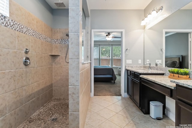 ensuite bathroom with a walk in shower, ensuite bathroom, ceiling fan, and visible vents