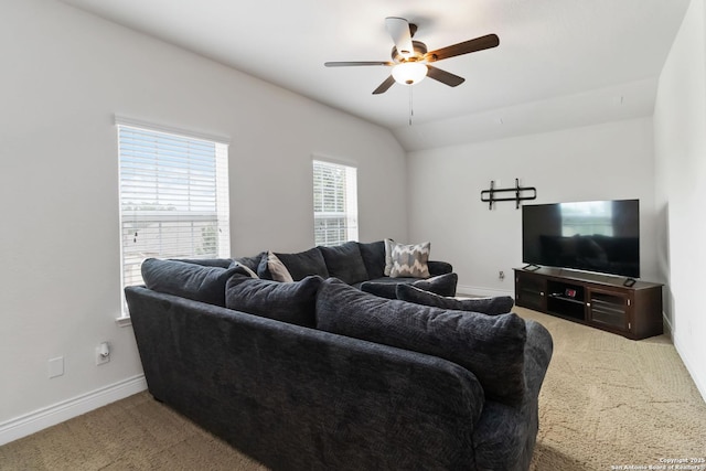 living room with carpet floors, a ceiling fan, and baseboards