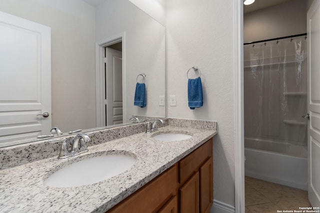 bathroom featuring tile patterned flooring, a sink, shower / bathtub combination with curtain, and double vanity
