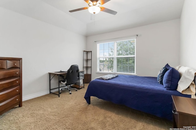 carpeted bedroom with baseboards and ceiling fan