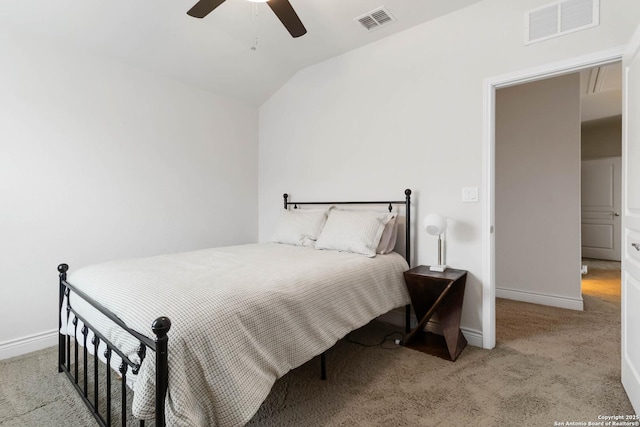 carpeted bedroom featuring visible vents, baseboards, ceiling fan, and vaulted ceiling