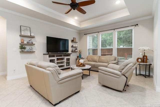 living room with crown molding, baseboards, ceiling fan, and light tile patterned flooring